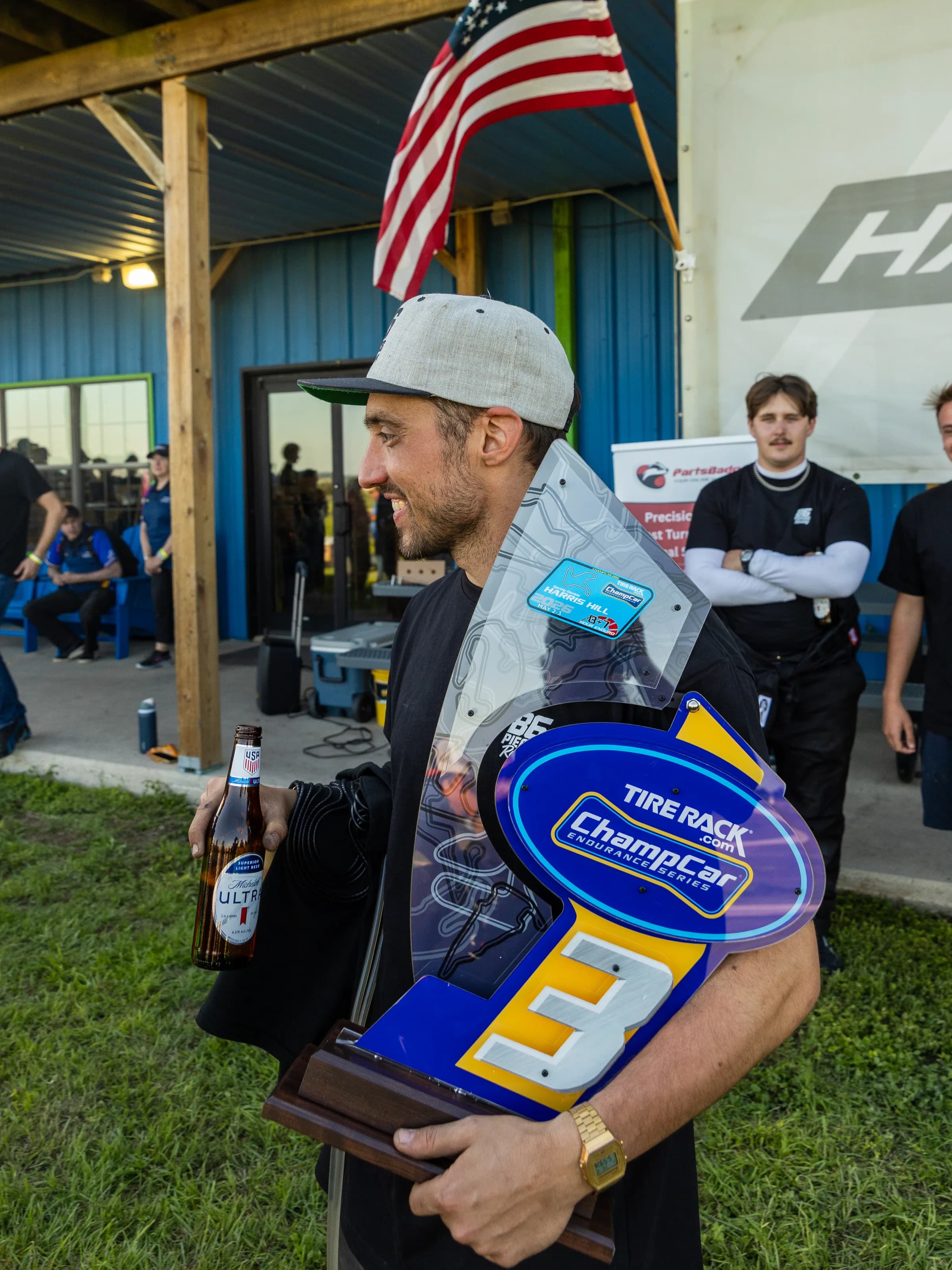 Eighty Six Pieces Racing shirt and hat during paddock work